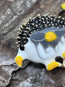 Hedgehog with daisy - enamel brooch badge