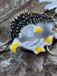 Hedgehog with daisy - enamel brooch badge